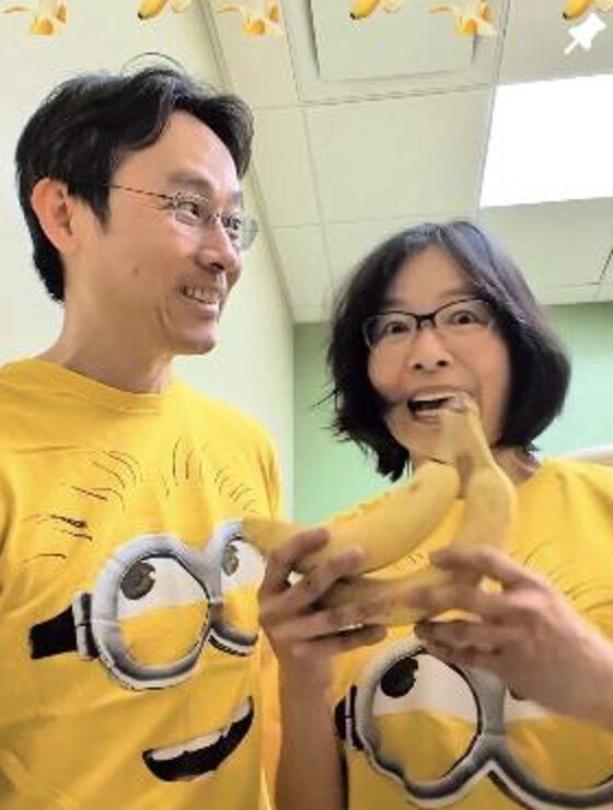 Dr. Huang and Dr. Shih dressed in matching Minion costumes holding bananas
