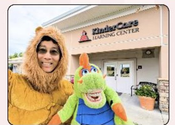 Team members in a lion costume and with a parrot mascot outside KinderCare Learning Center