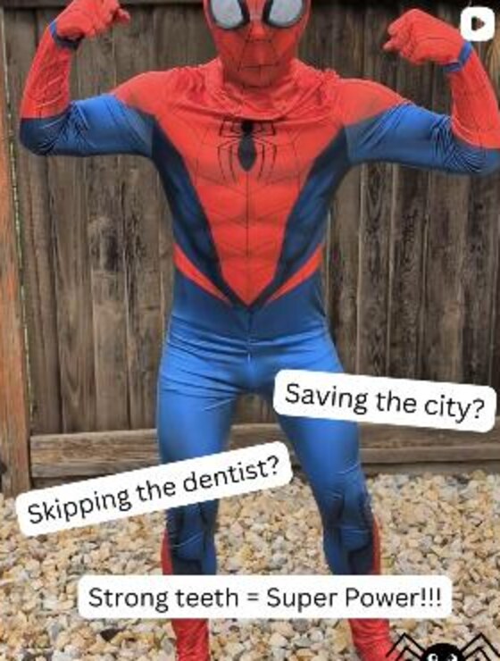 A team member in a Spider-Man costume with the caption strong teeth equals super power